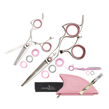 silver shear and texturizer with pink ring guards and pink knob with pink razor and pink case, cloth and oil pen