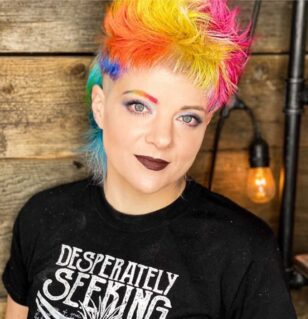 Woman with short rainbow hair in black shirt