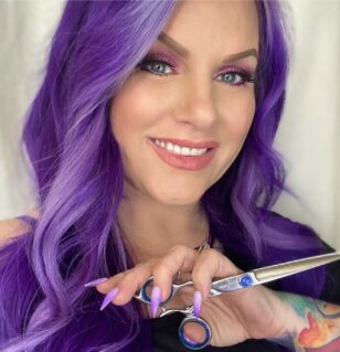 girl with purple hair holding shears